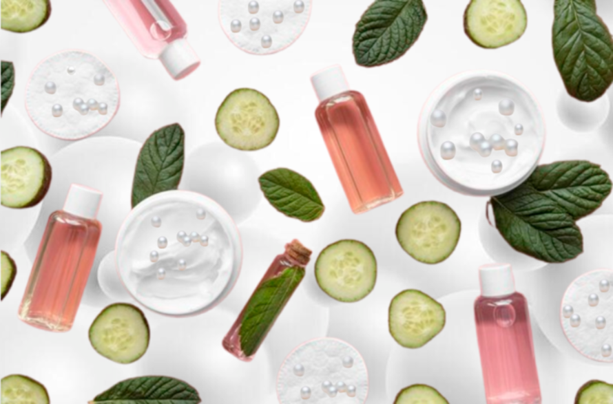 Collection Of Skin Care Products with cucumber, mint leaves, creams, pearl powder, bottles, and pearls.